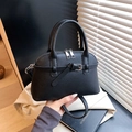 Chic black pebble grain leather handbag with silver buckle and removable shoulder strap - Black