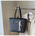 Detail of grey tote bag showing woven texture, thin straps, and silver abacus charm - With Pendant / Black