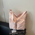 Light pink nylon tote bag with two front pockets and woven strap for casual style - Pink