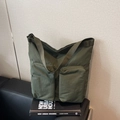 Minimalist large army green tote bag with multi-pocket design and wide shoulder strap - Green