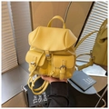 Bright yellow pebbled leather convertible backpack with metal buckle front pockets - Yellow