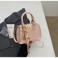 Pink patent leather shell bag with gold zippers and decorative tennis racket keychain - With Pendant / Pink