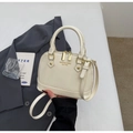 Close-up of cream shell handbag with gold hardware and removable shoulder strap - No Pendant / Off White