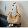Detail of woven straw tote bag with brown leather bow and matching shoulder strap texture - Natural Woven (Khaki) / Khaki