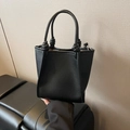Chic black litchi grain bucket bag with unique knotted handle and gold metal hardware - No Pendant / Black