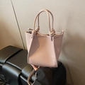 Dusty rose lychee grain leather bucket bag with top handles and knot detail - No Pendant / Pink