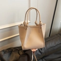 Beige pebble leather bucket bag with knot handle detail and adjustable strap - No Pendant / Khaki