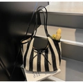Woven tote bag in black and white vertical stripes with a slender black bow accent - Vertical Striped Woven (Black) / Striped Black