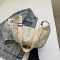 Minimalist beige nylon crescent crossbody bag with adjustable strap for daily casual wear - Off-white
