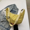 Bright yellow crescent dumpling bag with an adjustable cream-colored wide shoulder strap - Yellow