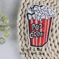 Popcorn design embroidered iron-on patch for DIY decor, size 5.8x8.2cm and weight 2.49g - Popcorn (ZG-4010)