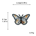 Écusson brodé papillon gris et noir avec détails orange, taille 6,6x4,1 cm - Broderie Papillon Gris Noir (11266)