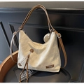 Close-up of beige canvas hobo bag with brown leather straps and mini round coin pouch - Off-white