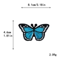 Écusson papillon bleu brodé avec contours noir et blanc pour décoration personnalisée - Broderie Papillon Bleu Vif (11296)