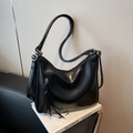 Minimalist black hobo shoulder bag with silver hardware and adjustable strap detail - Black
