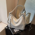 Minimalist beige hobo bag in glossy leather with adjustable strap and side tassels - Gray