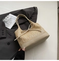 Detail of woven straw shoulder bag with leather bow decoration on grey blazer - Khaki Large