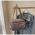 Neutral grey nylon crossbody bag with brown woven strap and multi-zipper compartments - Gray