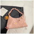 Detailed close-up of pink hobo bag with cloud texture handle and bear charm pendant - With Charm / Pink