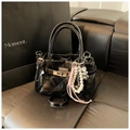 Quilted black leather handbag with metal turn-lock and elegant decorative charms - With Charm / Black