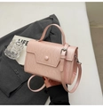 Detail of pink faux leather crossbody bag with flap closure and silver-tone hardware - Pink Without Pendant