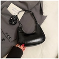 Detail of black leather crescent underarm bag with silver branding and dual straps - Black without Pendant