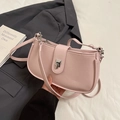 Pale pink faux leather hobo bag with silver twist lock and pebble grain texture - Pink