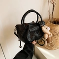 Mini black woven bucket bag with top handles and a cute teddy bear plush charm - Black (With Pendant)