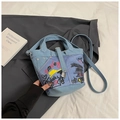 Detail of blue denim bucket bag with colorful graffiti prints and a metal lock pendant - No Pendant / Blue