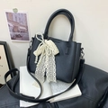 Chic black litchi grain bucket bag featuring a cream lace bow and pearl charm accents - Black with Pendant
