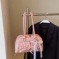 Pink glossy leather shoulder bag with bows, lace and pearl charms on black background - Pink with Pendant
