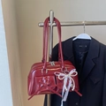 Deep red glossy leather bowling bag with bow pockets and pearl lace charm detail - Wine Red With Pendant