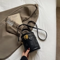 Black cylindrical bucket bag with lychee texture and golden bear charms on the zipper - Black without Pendant