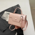 Elegant light pink crossbody handbag with circular buckle and adjustable strap - No Pendant / Pink