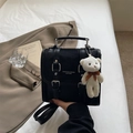 Chic black PU leather backpack with vintage buckles and a cute plush bear charm - Black