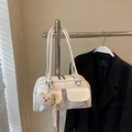Glossy white faux leather shoulder bag with front flap pockets and cute plush bear charm - With Charm / Off White