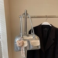 Metallic silver pillow bag with dual front pockets and plush bear charm on long strap - With Charm / Silver