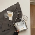 Chic silver metallic bucket bag with unique beaded handle and detachable shoulder strap - Silver No Pendant