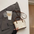 Chic cream and brown bucket bag with contrast handle and elegant gold logo detail - Rice White (No Pendant)