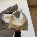 Elegante borsa hobo beige con ricamo a stella e tracolla rimovibile tenuta in mano - Bianco Sporco