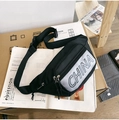 Detail view of water-resistant nylon waist bag with CHINA reflective patch and zipper pulls - Black