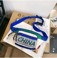Detail of a nylon crossbody bag with green CHINA text, blue strap, and plastic buckle - Blue and Green