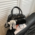 Glossy black bowling bag with dual top handles, silver hardware and pearl bow charm - Black with Pendant