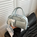 Light blue bowling bag in matte PU leather with pearl bow charm and twin front pockets - Blue with Charm