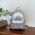 Silver metallic mini backpack with pink floral prints and a white plush monster charm - Large Silver With Pendant