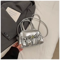 Macro shot of silver pleated Boston bag with metallic texture and ball clasp detail - Silver No Pendant