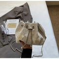 Detailed view of white floral lace bucket bag with 3D butterfly accents and chain strap - Beige Crossbody