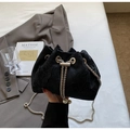 Detail of black drawstring bucket bag with floral embroidery and pearl chain accents - Black Single Shoulder