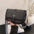 Retro black leather crossbody bag with woven flap and geometric patterned wide strap - Black