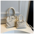Detail of off-white tote bags with vertical striped texture and silver metal buckle accents - Large / White